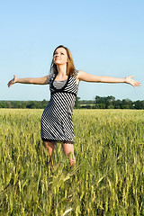 Image showing attractive young woman in the field