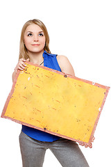 Image showing Pretty young woman posing with yellow vintage board