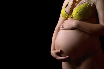 Image showing Belly of a pregnant girl. Isolated