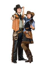 Image showing cowboy and cowgirl with a guns