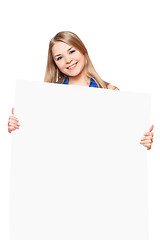 Image showing Joyful young woman posing with white board