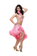Image showing Cheerful brunette in pink dancing dress. Isolated