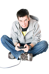 Image showing Furious guy with a joystick for game console