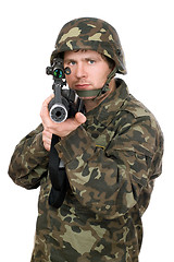 Image showing Soldier aiming a rifle. Closeup