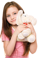 Image showing Portrait of little girl with a teddy elephant