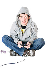 Image showing Young man in hood with a joystick