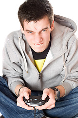 Image showing Portrait of furious young man with a joystick