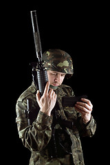 Image showing Soldier changing magazine of m16