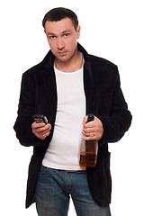 Image showing Man with a phone and bottle of scotch