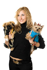 Image showing Portrait of cheerful young blonde with two dogs