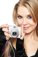 Image showing Smiling beautiful blonde holding a photo camera