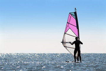 Image showing Silhouette of a woman windsurfer