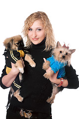 Image showing Portrait of smiling pretty blonde with two dogs. Isolated