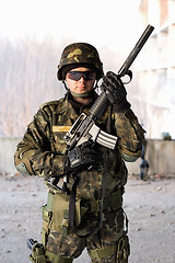 Image showing Handsome guy holding a rifle