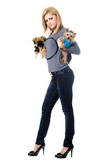 Image showing Pretty young blonde posing with two dogs