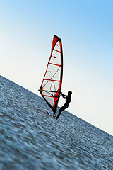 Image showing Silhouette of a windsurfer on the sea