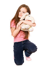 Image showing Happy little girl with a teddy elephant