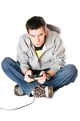 Image showing Guy with a joystick for game console. Isolated