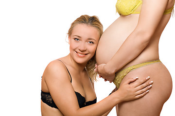 Image showing Happy woman and belly of pregnant girlfriend