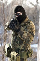 Image showing Portrait of soldier with a handgun