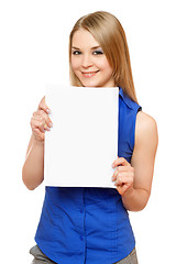 Image showing Smiling young woman holding empty white board