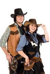 Image showing young cowboy and cowgirl. Isolated