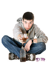 Image showing Young man with a glass of whiskey