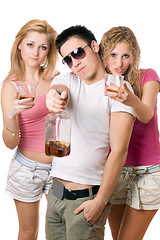 Image showing Young people with a bottle of whiskey. Isolated