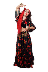 Image showing Expressive gypsy woman in a black skirt. Isolated
