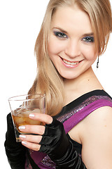 Image showing Smiling young blonde with a glass