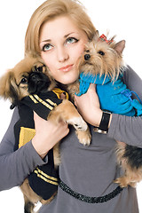Image showing Portrait of attractive young blonde with two dogs. Isolated