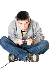 Image showing Young man with a joystick