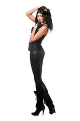 Image showing Pretty brunette in black leggings. Isolated