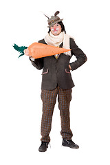 Image showing Smiling young man with carrot