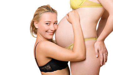 Image showing girl and belly of pregnant girlfriend