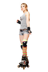 Image showing Pretty young blonde on roller skates