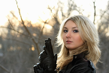 Image showing young woman at the sunset