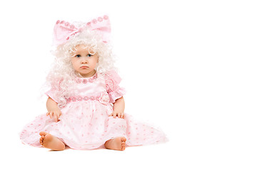 Image showing Sad baby girl in a pink dress