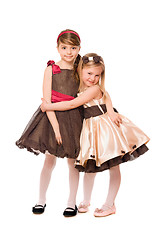 Image showing Two cute little girls in a dress. Isolated
