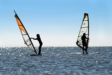 Image showing Silhouette of a two windsurfers