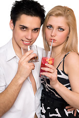 Image showing Young couple with cocktails. Isolated