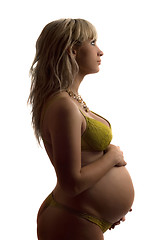 Image showing Pregnant young woman in yellow lingerie