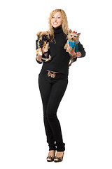 Image showing Smiling pretty young blonde posing with two dogs