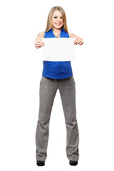 Image showing Happy young blonde holding empty white board. Isolated