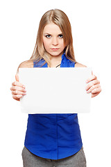 Image showing Serious young blonde holding empty white board