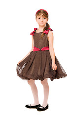 Image showing Attractive little lady in a brown dress