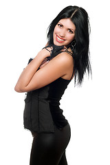 Image showing Portrait of a cheerful brunette in black clothes