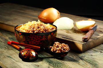 Image showing Spoon and bowl of buckwheat.