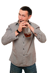 Image showing Man opens a bottle of whiskey