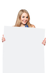 Image showing Happy young woman posing with white board